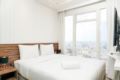 Tranquil 2BR at Menteng Park Apartment By Travelio ホテル詳細